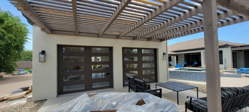 Contemporary residential garage doors with horizontal glass-panel windows