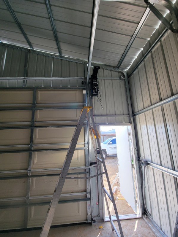 Residential garage door opener hardware and interior access ladder